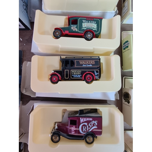 178 - A large collection of 33 Diecast Model Vans and Cars, all with packaging.
Mainly advertising vans su... 