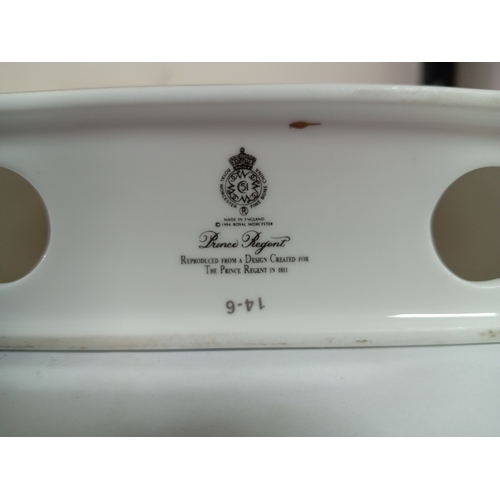 26 - A Royal Worcester ceramic clock and candlestick both with floral design.