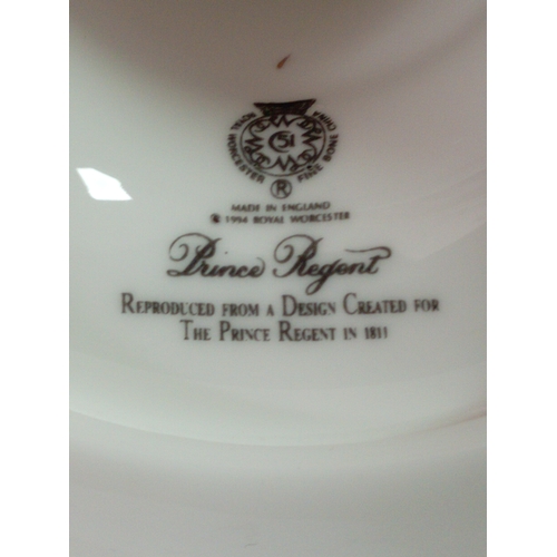 26 - A Royal Worcester ceramic clock and candlestick both with floral design.