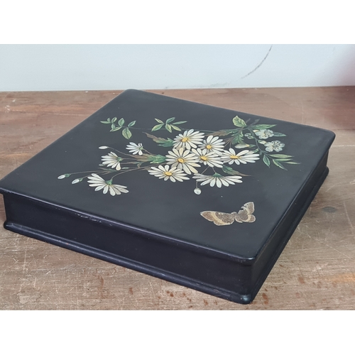 27 - 2 vintage black lacquered lidded boxes with hand painted floral designs, the square Victorian style ... 