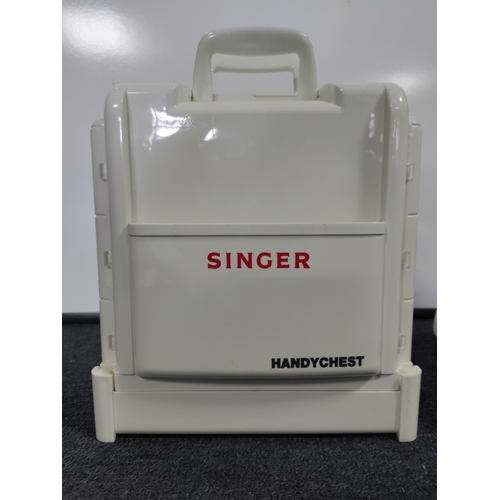 28 - A necchi super utility sewing machine with foot pedal and a singer handy chest