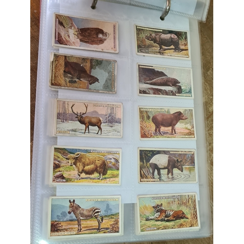 29 - A substantial collection of Cigarettes Cards housed in an album with over 600 cards. Brands mainly c... 