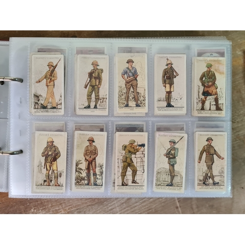 29 - A substantial collection of Cigarettes Cards housed in an album with over 600 cards. Brands mainly c... 