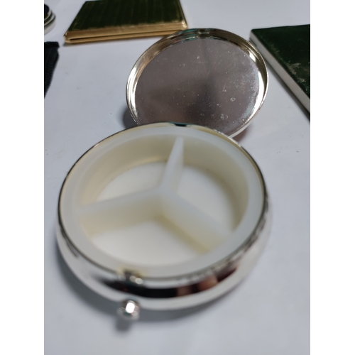 31 - A heart shaped white metal jewellery box and a collection of hand held mirrors and a pair of pill bo... 