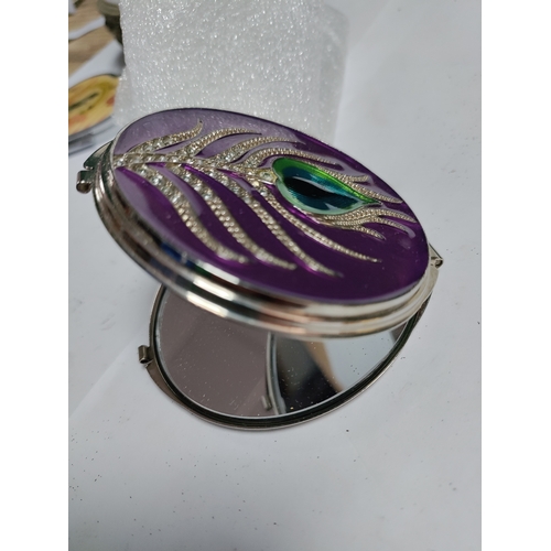 31 - A heart shaped white metal jewellery box and a collection of hand held mirrors and a pair of pill bo... 