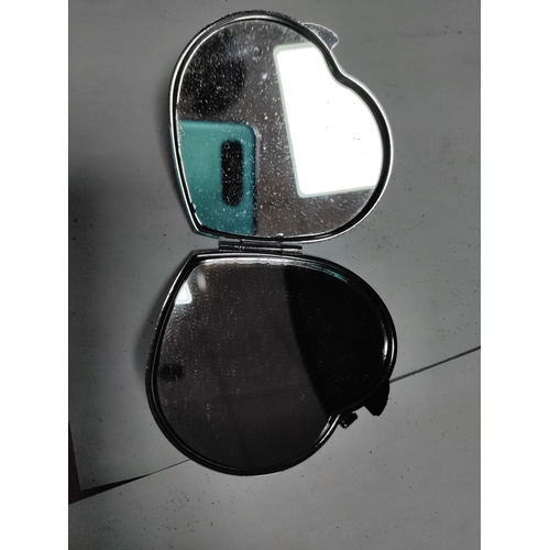 31 - A heart shaped white metal jewellery box and a collection of hand held mirrors and a pair of pill bo... 