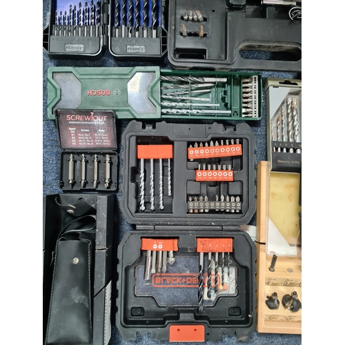 33 - A large job lot of of Drill Bit sets, Dremel tool sets and associated tools, includes a Workzone Piv... 