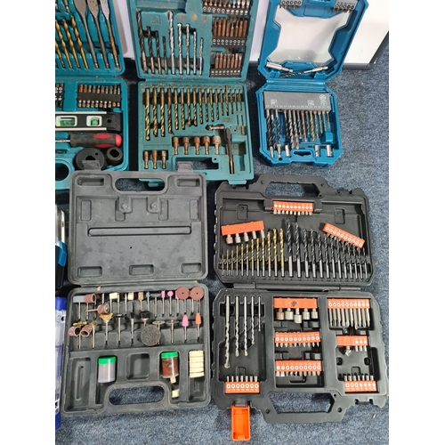 33 - A large job lot of of Drill Bit sets, Dremel tool sets and associated tools, includes a Workzone Piv... 