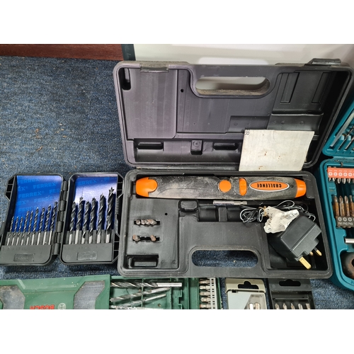 33 - A large job lot of of Drill Bit sets, Dremel tool sets and associated tools, includes a Workzone Piv... 