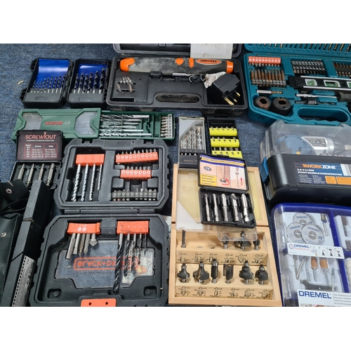 33 - A large job lot of of Drill Bit sets, Dremel tool sets and associated tools, includes a Workzone Piv... 