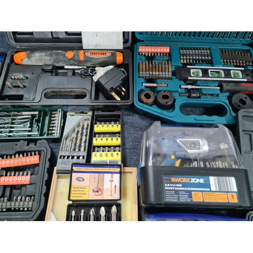 33 - A large job lot of of Drill Bit sets, Dremel tool sets and associated tools, includes a Workzone Piv... 