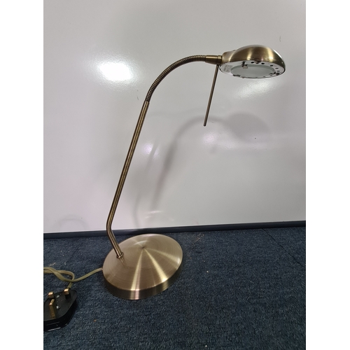 35 - A brass toned desk lamp with adjustable gooseneck light. Max reach 55cm.