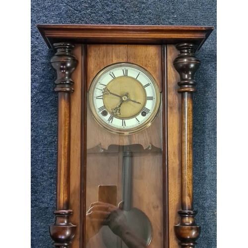 201 - A German /Austrian Antique Walnut Wall Clock. Measures 72cm high by 31.5cm wide by 18cm deep.