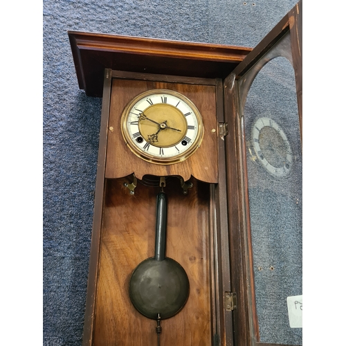 201 - A German /Austrian Antique Walnut Wall Clock. Measures 72cm high by 31.5cm wide by 18cm deep.