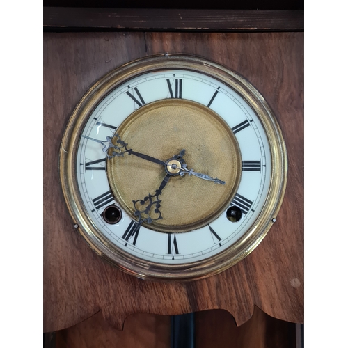 201 - A German /Austrian Antique Walnut Wall Clock. Measures 72cm high by 31.5cm wide by 18cm deep.
