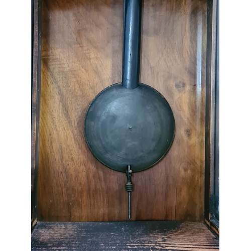 201 - A German /Austrian Antique Walnut Wall Clock. Measures 72cm high by 31.5cm wide by 18cm deep.