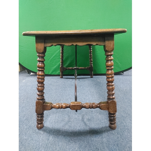 166 - A vintage wooden coffee table with wrought iron supports H 46 cm x D 40cm x W 85cm