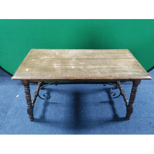 166 - A vintage wooden coffee table with wrought iron supports H 46 cm x D 40cm x W 85cm