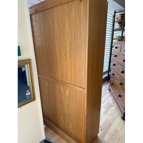 168 - Tall light oak bookcase. Very good quality and in great condition. 6 foot tall by 35 and a half inch... 