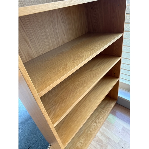 168 - Tall light oak bookcase. Very good quality and in great condition. 6 foot tall by 35 and a half inch... 