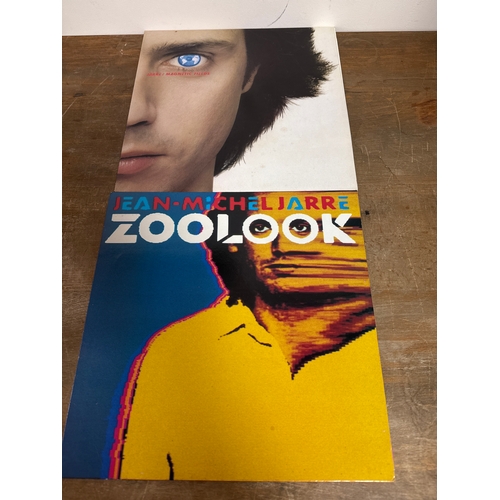 553 - Pair of Jean michel jarre vinyl records in mixed conditions