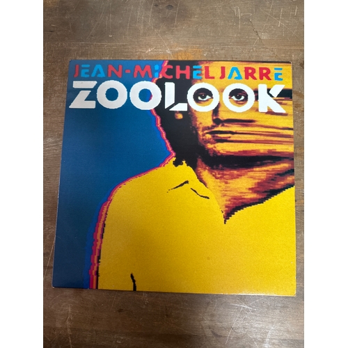 553 - Pair of Jean michel jarre vinyl records in mixed conditions