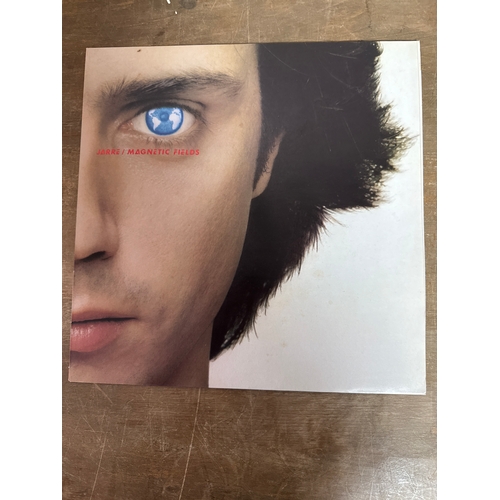 553 - Pair of Jean michel jarre vinyl records in mixed conditions