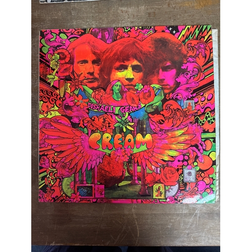 555 - Pair of cream  vinyl records in mixed conditions