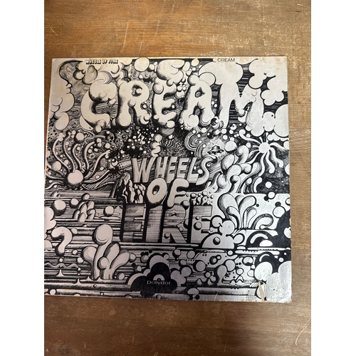 555 - Pair of cream  vinyl records in mixed conditions