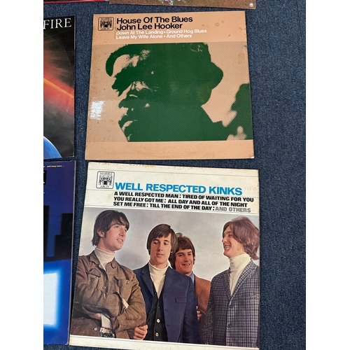 557 - Collection of vinyl records in various conditions and they come complete with a vinyl record case.