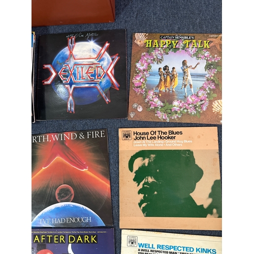 557 - Collection of vinyl records in various conditions and they come complete with a vinyl record case.