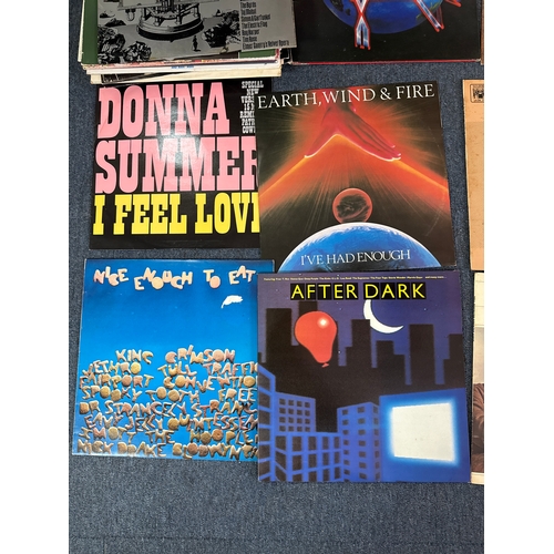 557 - Collection of vinyl records in various conditions and they come complete with a vinyl record case.