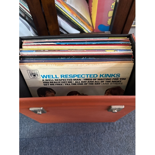 557 - Collection of vinyl records in various conditions and they come complete with a vinyl record case.