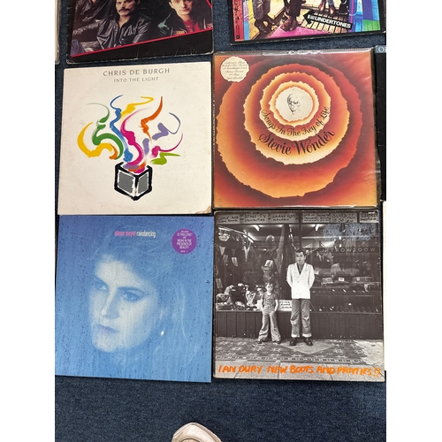 606 - Collection of vinyl records in various conditions