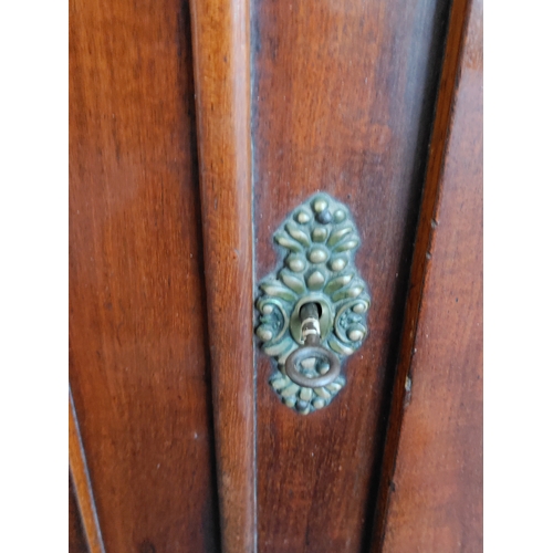170 - An antique Victorian corner cabinet with Inlayed doors. Comes with original key. H 107cm x W 91cm x ... 