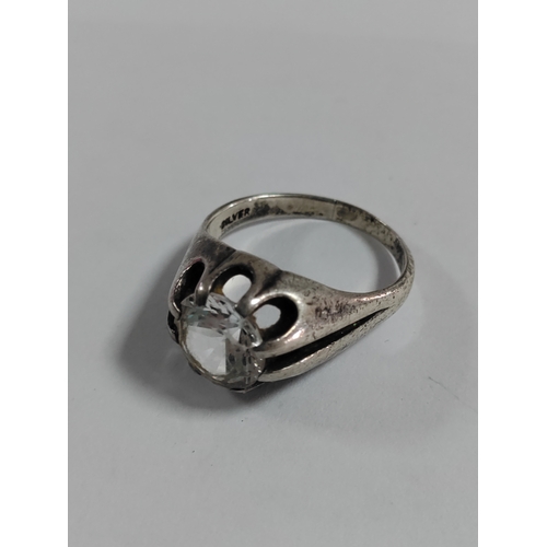 315 - A trio of stamped 925 and silver rings. With two boxes.