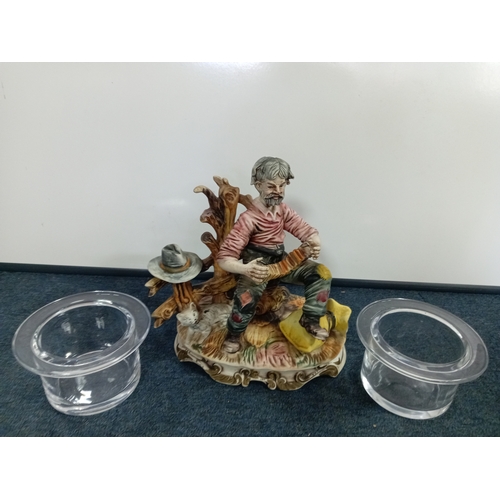 64 - A Capodimonte statue of a man playing accordian H 28 W 30 and a pair of large glass candle holders