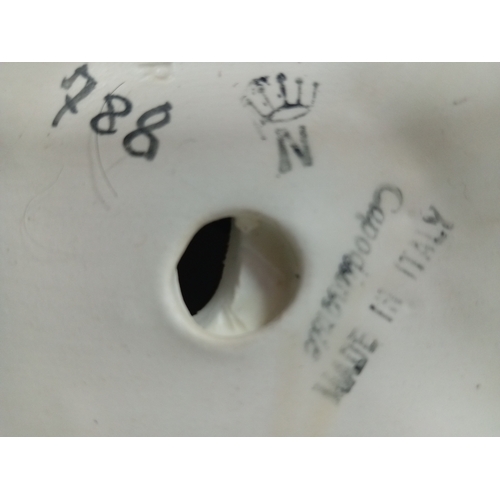 64 - A Capodimonte statue of a man playing accordian H 28 W 30 and a pair of large glass candle holders