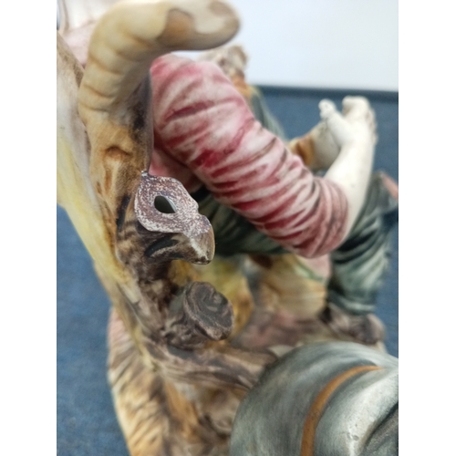 64 - A Capodimonte statue of a man playing accordian H 28 W 30 and a pair of large glass candle holders