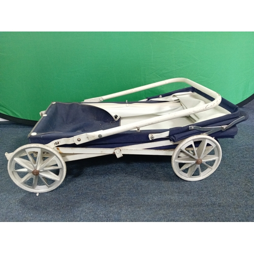 65 - A vintage navy blue collapsible dolls pram