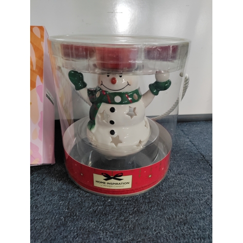 68 - Boxed Yankee candles and boxed snowman with tea lights.