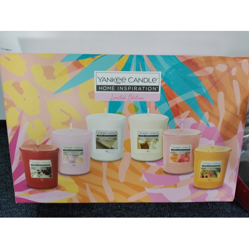 68 - Boxed Yankee candles and boxed snowman with tea lights.