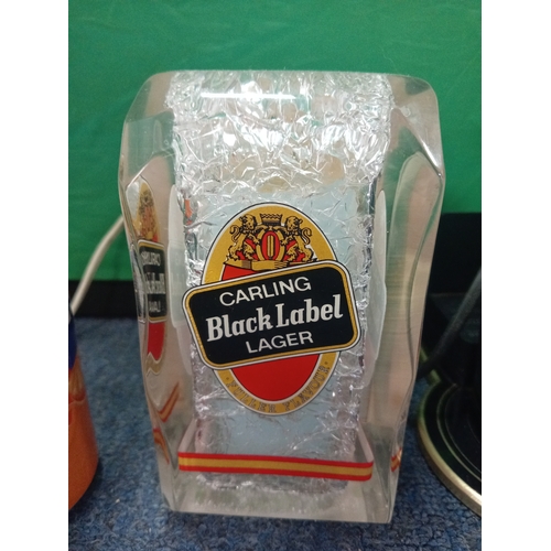 218 - Two vintage bar top fonts. One Carling black label and the other guiness.