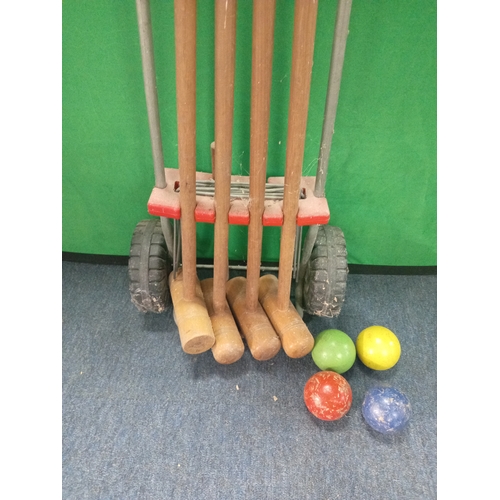 219 - A vintage croquet set. Complete.