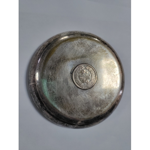 272 - A pair of ashtrays with coins mounted in the centre. One has a silver 1932 Iraq 200 fils and is beli... 