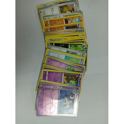 197 - A collection of pokemon cards to include a crown zenith booster pack, a crown zenith tin and a stack... 