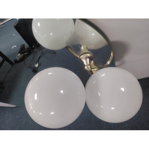 120 - A mirror with fitted lights and art depicting a street lamp