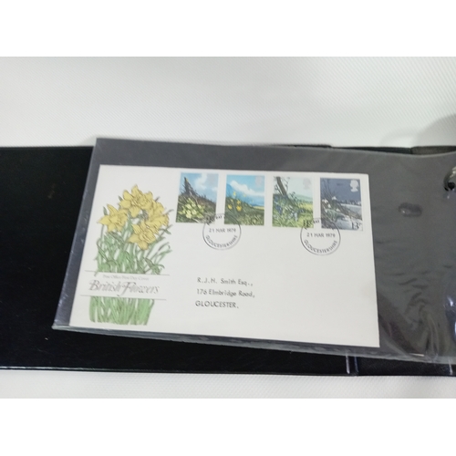 265 - An album with APX 50 first day covers mostly from 70s-80s. Last few pages are royal mail mint stamps... 