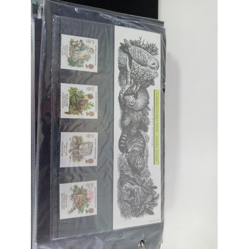 265 - An album with APX 50 first day covers mostly from 70s-80s. Last few pages are royal mail mint stamps... 