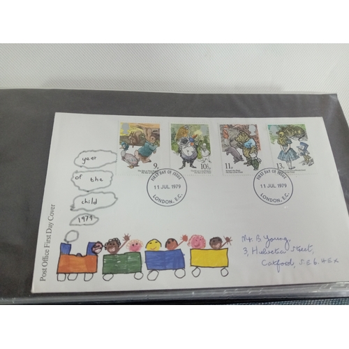 265 - An album with APX 50 first day covers mostly from 70s-80s. Last few pages are royal mail mint stamps... 